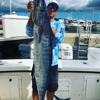 a person holding a fish