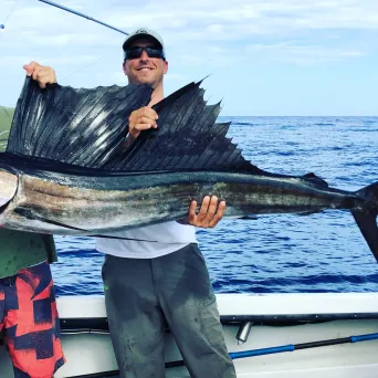 a man riding on the back of a boat